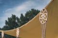 Yellow wedding canopy with lucky dream catchers