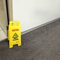 Yellow Wet floor sign Royalty Free Stock Photo