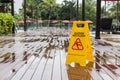 Yellow wet floor warning sign on the floor in hotel