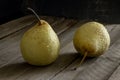 Yellow wet pear wooden background Royalty Free Stock Photo