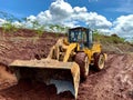 yellow wheel loader in action while on duty Royalty Free Stock Photo