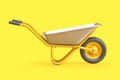 Yellow wheelbarrow on yellow background Royalty Free Stock Photo