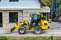 Yellow wheeled tractor forklift. Construction equipment for lifting and moving loads. Forklift