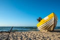 A yellow white boats on beautiful beach Royalty Free Stock Photo