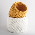 Yellow and white handmade basket, on a white background. texture of knitted fabric braids Royalty Free Stock Photo