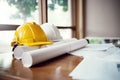 Yellow and white hard safety wear helmet hat placed on blueprint at construction site Royalty Free Stock Photo