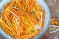 Yellow, white and orange candles are in the metal tray out of focus Royalty Free Stock Photo