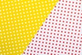 A yellow and white paper background with white and red polka dots Royalty Free Stock Photo