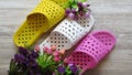 Top view. Yellow, White and Pink Shower Sandals / Quick Drying Bath Slippers and Flowers.