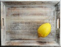 yellow whole lemon on a wooden box