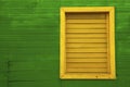 Yellow window on green house Royalty Free Stock Photo