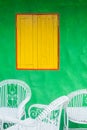 Yellow window and green wall Royalty Free Stock Photo