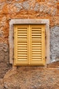 Yellow window shutters of an old house in Lovran Royalty Free Stock Photo