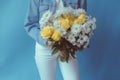 blue woman white anniversary hand flower yellow romantic sweater bouquet floral. Generative AI.