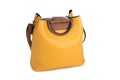 Yellow women bag over white background. Women accessory