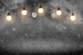 Yellow fantastic shining glitter lights defocused bokeh abstract background with light bulbs and falling snow flakes fly, festal Royalty Free Stock Photo