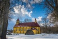 Yellow wooden church in a village Silenai