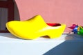 Yellow wooden dutch clog