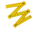 Yellow wooden folding rule on a white Royalty Free Stock Photo