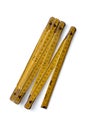 Yellow wooden folding ruler on a white background Royalty Free Stock Photo