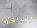 yellow wooden heart shapes on grey concrete surface. Demonstrating trendy colors of year 2021