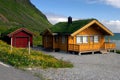 Yellow wooden house with grass roof