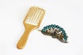 Yellow wooden massage comb and decorative hair a clips