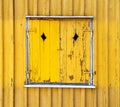 Yellow wooden painted window shutters, background texture Royalty Free Stock Photo