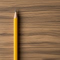 A yellow wooden pencil with a sharpened graphite tip rests vertically on a surface with Royalty Free Stock Photo