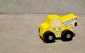 Yellow wooden toy crane truck on a white background.Children\'s car, Montessori eco kid toys. Royalty Free Stock Photo