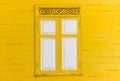 Yellow wooden wall with white window Royalty Free Stock Photo