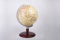 Yellow world atlas globe isolated on a gray background Royalty Free Stock Photo