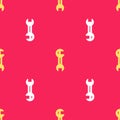 Yellow Wrench spanner icon isolated seamless pattern on red background. Vector