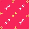 Yellow Wrench spanner icon isolated seamless pattern on red background. Vector