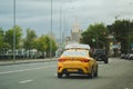 05.2020: a yellow Yandex taxi car is driving along a street in Moscow