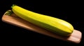 a yellow zucchini on a wooden surface
