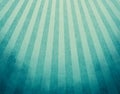 Yellowed blue retro background with faded grunge borders and soft blue and yellow stripes sunburst effect or starburst design