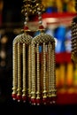 Yellowish hanging ladies ornaments in a shop