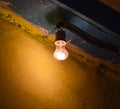 The yellowish light of incandescent lamps at dusk on the street. Light Ilyich - incandescent lamp - lamp Edison Royalty Free Stock Photo
