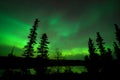 Reflection of Aurora borealis on a lake in Yellowknife, Canada Royalty Free Stock Photo