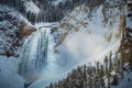 Yellowstone Canyon waterfall with illuminated mist Royalty Free Stock Photo