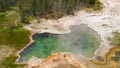 Yellowstone Geyser As Seen From Above. Pool In The Middle Of The Forest, Wyoming