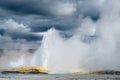 Yellowstone Geyser With Bright White Water Spray During Storm.
