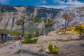 YELLOWSTONE, MONTANA, USA JUNE 02, 2018: Above view of group of people walking in a boardwalk in Mammoth hot springs