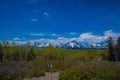 YELLOWSTONE, MONTANA, USA MAY 24, 2018: Close up of informative sign of Teton range and the valley mountains landscape