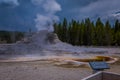 YELLOWSTONE, MONTANA, USA MAY 24, 2018: Informative sign of castle Geyser, Yellowstone National Park. The cone in the