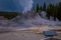 YELLOWSTONE, MONTANA, USA MAY 24, 2018: Informative sign of castle Geyser, Yellowstone National Park. The cone in the
