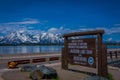 YELLOWSTONE, MONTANA, USA MAY 24, 2018: Informative sign in Jackson Lake Dam built in 1911 in Grand Teton National Park Royalty Free Stock Photo