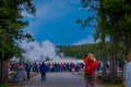 YELLOWSTONE, MONTANA, USA MAY 24, 2018: Outdoor view of crowd of tourists watching and taking pictures of the Old Royalty Free Stock Photo