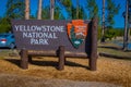 YELLOWSTONE, MONTANA, USA MAY 24, 2018: Outdoor view of informative sign of Yellowstone National Park on wooden